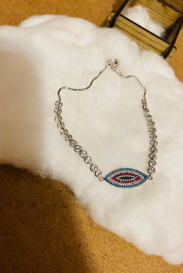 Ασημένιο βραχιόλι με μάτι και πέτρες ζιργκόν