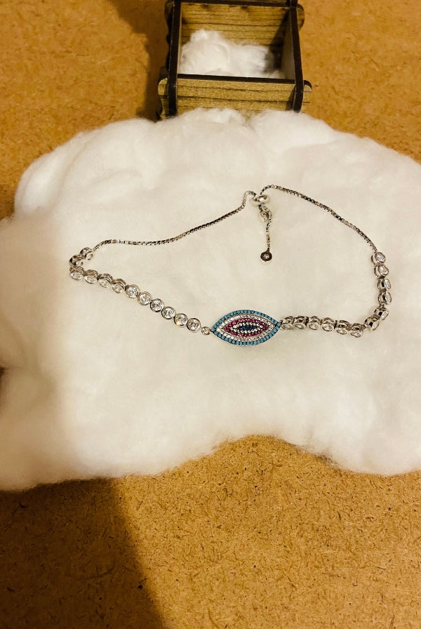 Ασημένιο βραχιόλι με μάτι και πέτρες ζιργκόν