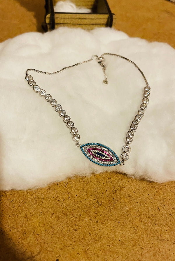 Ασημένιο βραχιόλι με μάτι και πέτρες ζιργκόν