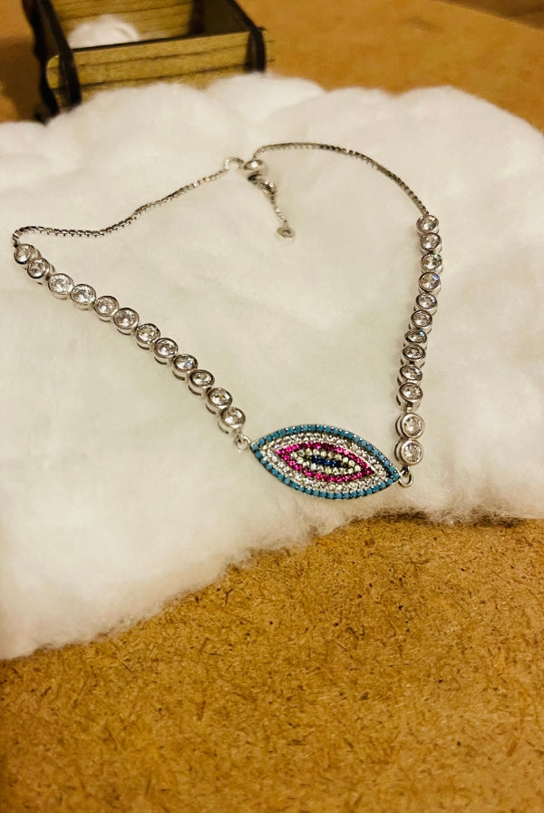 Ασημένιο βραχιόλι με μάτι και πέτρες ζιργκόν